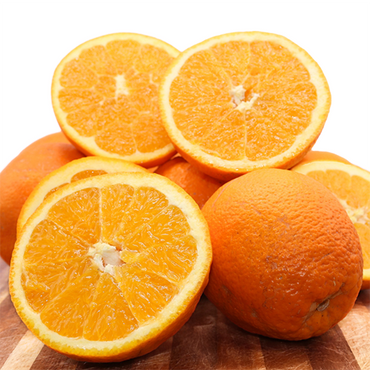 Ripe Algarve oranges with sliced pieces on a wooden board. Enjoy fresh citrus fruits, perfect for a natural, sweet taste.