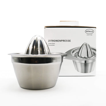 Stainless steel lemon squeezer with packaging on a white background