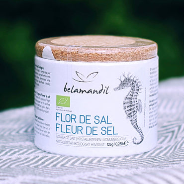 Container of Necton 'Flor de Sal' with a seahorse design on a textured surface