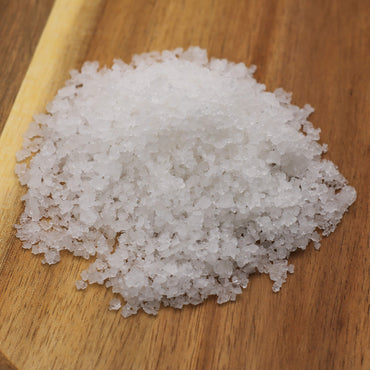 Coarse salt on a wooden surface