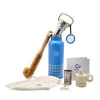 Blue water bottle with cleaning brush, pouch, and other accessories on a white background