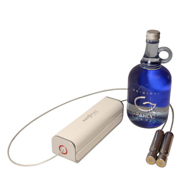 Blue glass bottle with a white electronic device on a white background