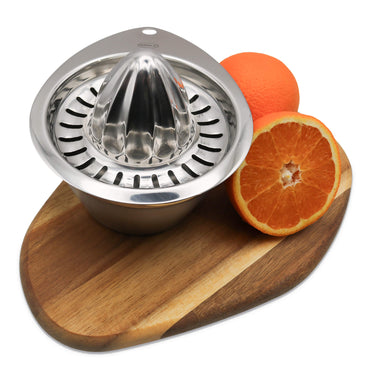 Stainless steel manual juicer on a wooden board with an orange and half an orange.