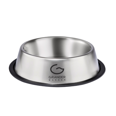 Stainless steel dog bowl with black rubber base on a white background