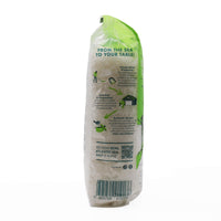 Bag of salt with green and white design on a white background