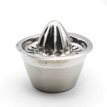 Stainless steel manual juicer on a white background