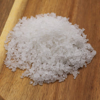 Coarse salt on a wooden surface