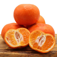 Sweet Algarve tangerines, some whole and one cut open to reveal juicy segments. Buy a 1 kg mixed box of fresh oranges and tangerines today.
